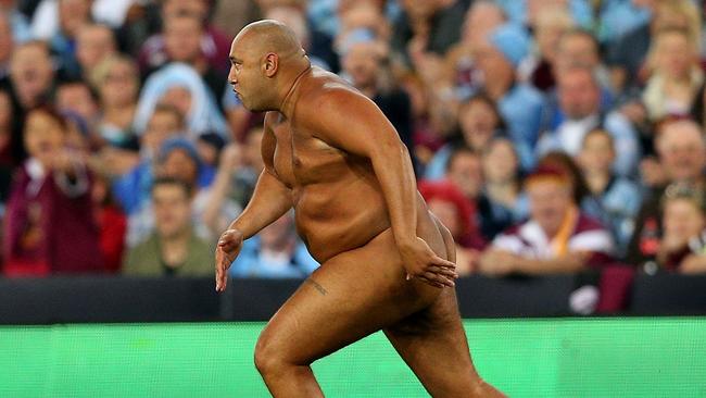 A streaker runs onto the field during game three of the State of Origin series between the New South Wales Blues and Queensland Maroons at ANZ Stadium in 2013.