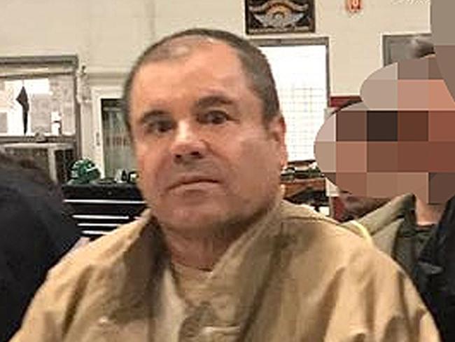 (FILES) In this file photo taken on January 19, 2017 This handout picture released by the Mexican Interior Ministry shows Joaquin Guzman Loera aka "El Chapo" Guzman (C) escorted in Ciudad Juarez by the Mexican police as he is extradited to the United States. - Joaquin "El Chapo" Guzman goes on trial in New York on Monday, accused of running the world's biggest drug cartel and spending a quarter of a century smuggling more than 155 tons of cocaine into the United States. (Photo by HO / INTERIOR MINISTRY OF MEXICO / AFP) / RESTRICTED TO EDITORIAL USE-MANDATORY CREDIT "AFP PHOTO/INTERIOR MINISTRY OF MEXICO" NO MARKETING NO ADVERTISING CAMPAIGNS-DISTRIBUTED AS A SERVICE TO CLIENTS-XGTY