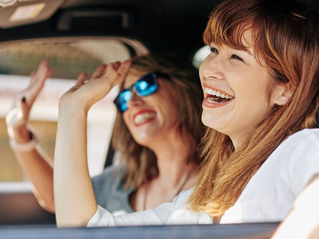 At Home 2023: April 1 issue, The Fixer, smells like teen spirit. Picture: iStockHappy excited pretty young woman waving with hands when riding in car