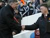 Manchester United’s manager Louis Van Gall, right, shakes hands with West Ham United’s manager Sam Allardyce before the English Premier League soccer match between West Ham United and Manchester United at the Boleyn Ground in London, Sunday, Feb. 8, 2015. (AP Photo/Alastair Grant)