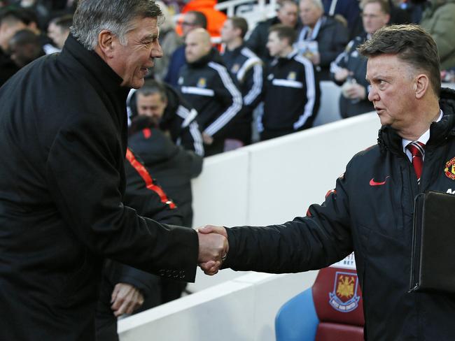 Manchester United’s manager Louis Van Gall, right, shakes hands with West Ham United’s manager Sam Allardyce before the English Premier League soccer match between West Ham United and Manchester United at the Boleyn Ground in London, Sunday, Feb. 8, 2015. (AP Photo/Alastair Grant)