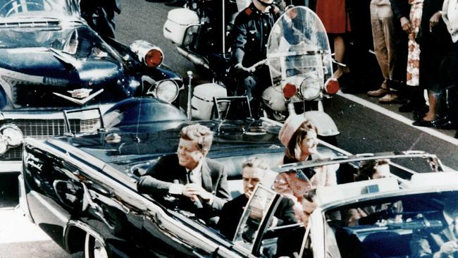 President John F Kennedy in the presidential limousine before his assassination. His wife Jacqueline is next to him and Texas Governor John Connally and his wife Nellie sit in front. Picture: Getty Images,