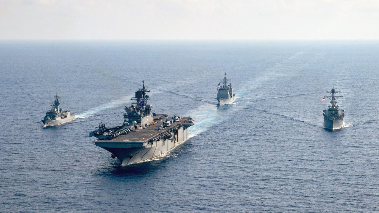 The Royal Australian Navy guided-missile frigate HMAS Parramatta (FFH 154) with US Navy vessels in the South China Sea in previous war games. Picture: US Navy.