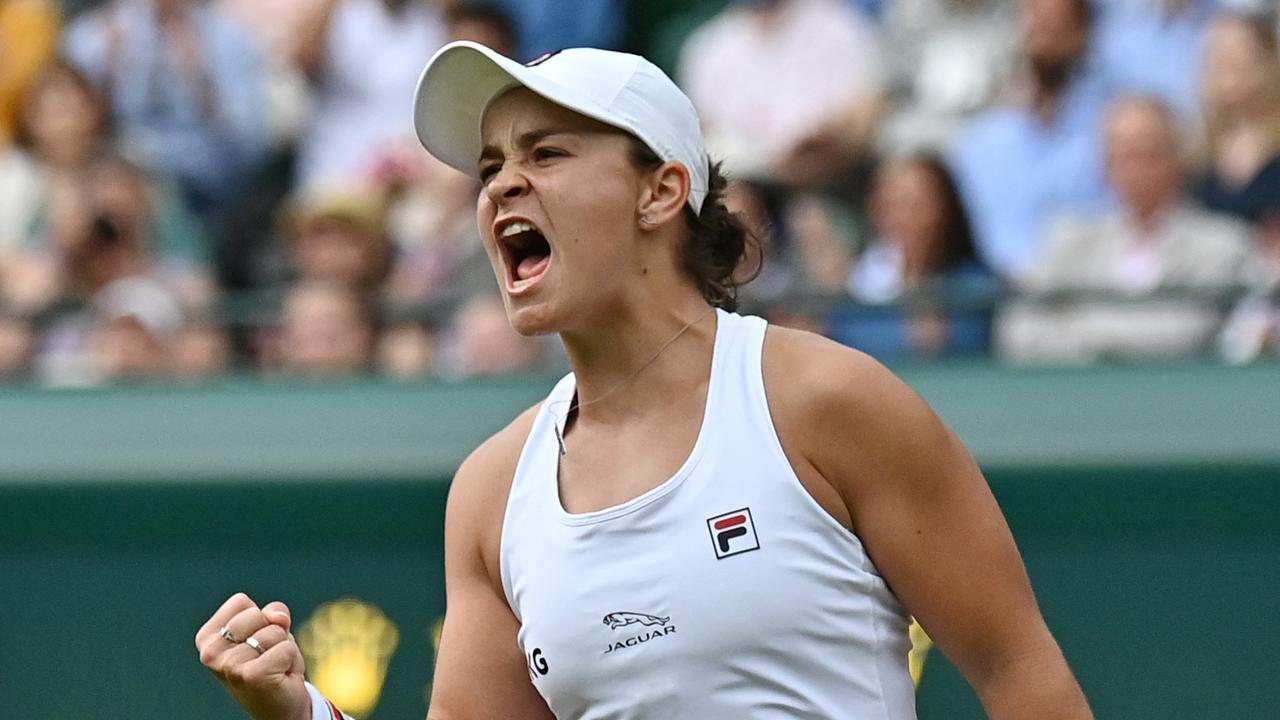 TOPSHOT - Australia's Ashleigh Barty celebrates after beating Czech Republic's Barbora Krejcikova during their women's singles fourth round match on the seventh day of the 2021 Wimbledon Championships at The All England Tennis Club in Wimbledon, southwest London, on July 5, 2021. (Photo by Ben STANSALL / AFP) / RESTRICTED TO EDITORIAL USE