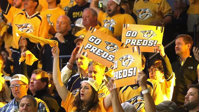 Nashville Predators fans cheer on their team against the Pittsburgh Penguins.