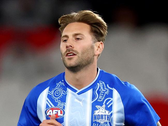 MELBOURNE, AUSTRALIA - MAY 01: Caleb Daniel of the Kangaroos warms up ahead of his 200th game during the round eight AFL match between Essendon Bombers and North Melbourne Kangaroos at Marvel Stadium, on May 01, 2025, in Melbourne, Australia. (Photo by Josh Chadwick/Getty Images)