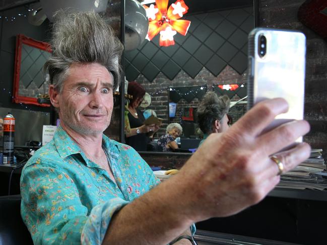 Dave Hughes has his scraggly locks styled ahead of a photoshoot for Melbourne International Comedy Festival. Picture: David Caird