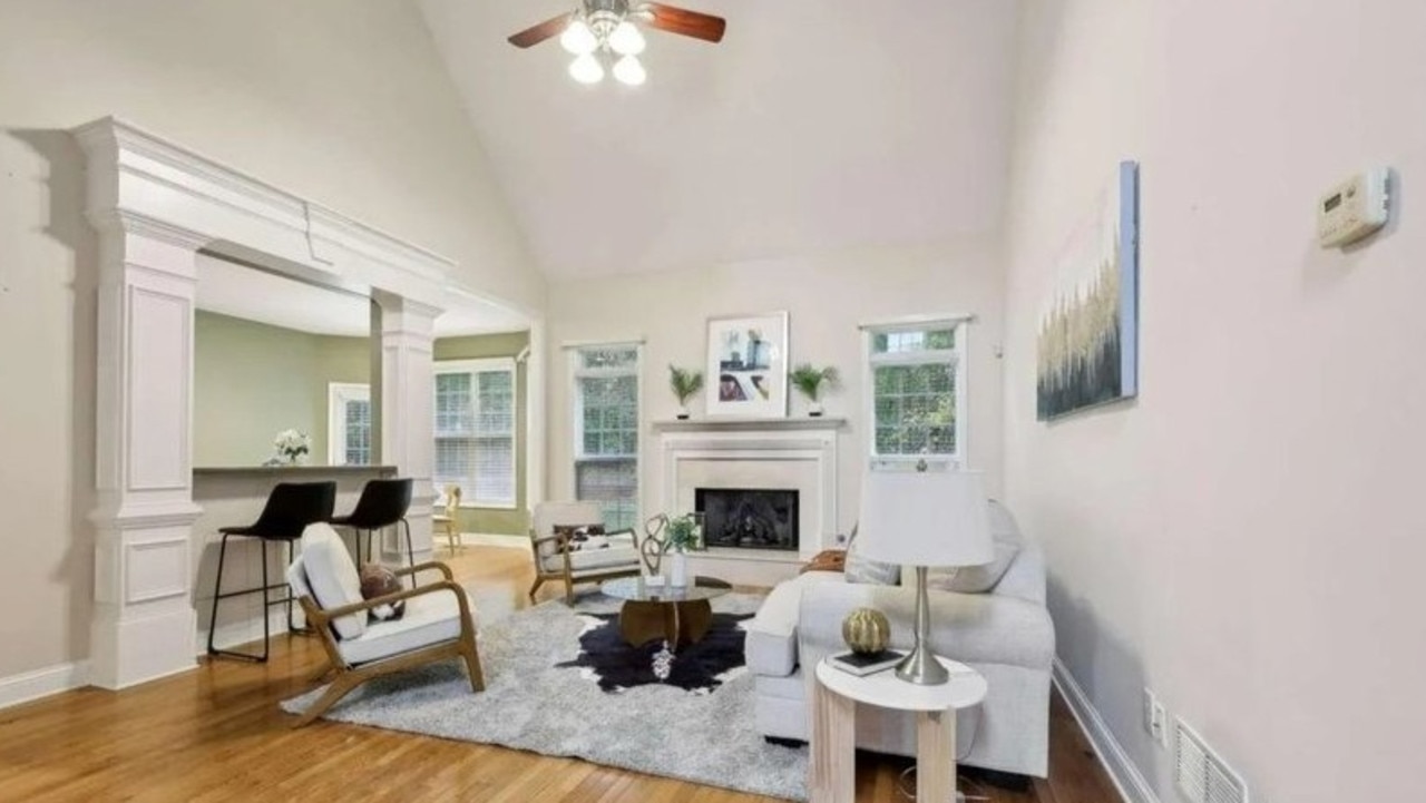 The family room has a vaulted ceiling and a cozy fireplace. Picture: Realtor