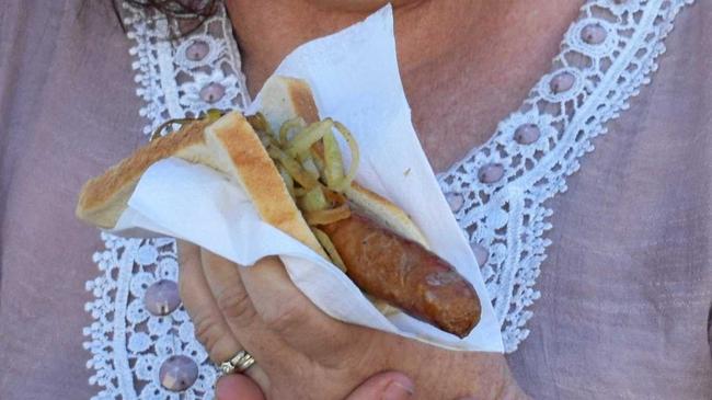 Terese Turner was one of many customers to support farmers by purchasing a sausage on bread at the Bunnings Sausage Sizzle. Picture: Geordi Offord