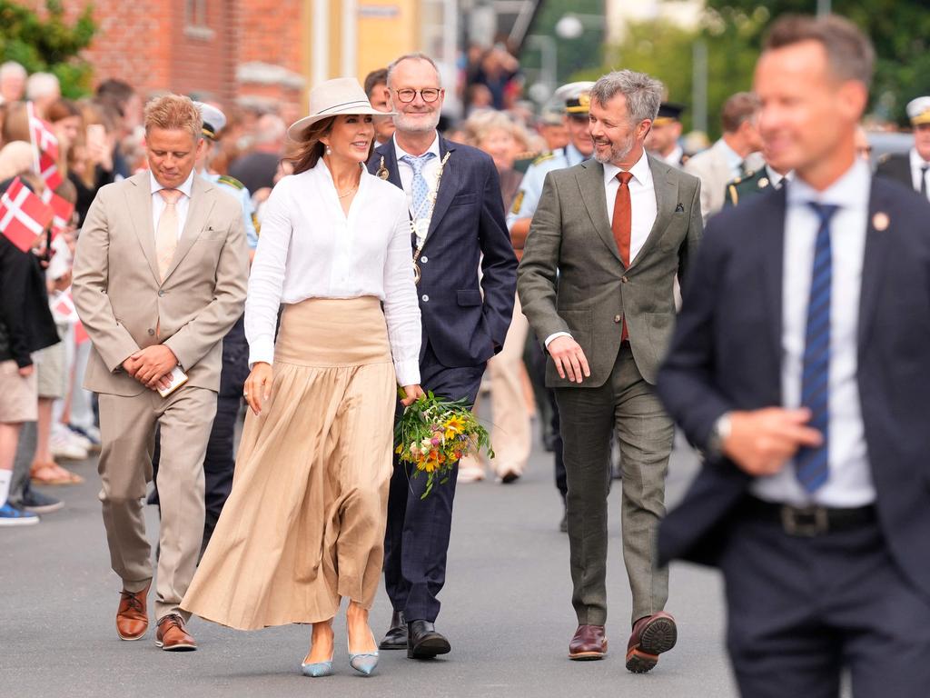 Queen Mary was presented with flowers by royal fans. Picture: AFP