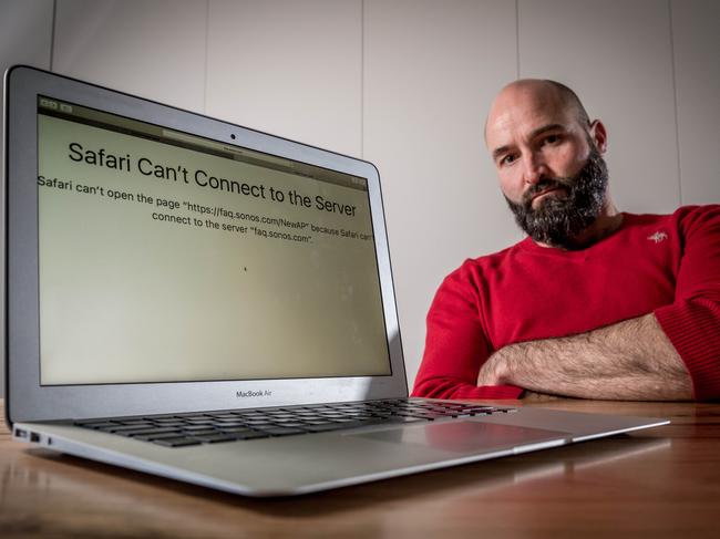 Frustrated Martin Bucher says he has had no home internet service for his laptop for the last four weeks and that since hooking up to the NBN it has been a "total nightmare". Picture: Jake Nowakowski