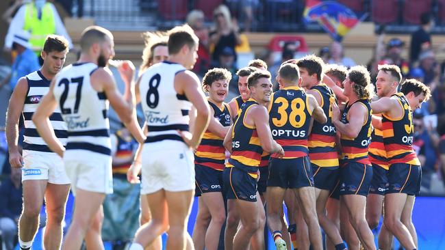 Crows celebrate a Taylor Walker of the Crows goal at the half time siren