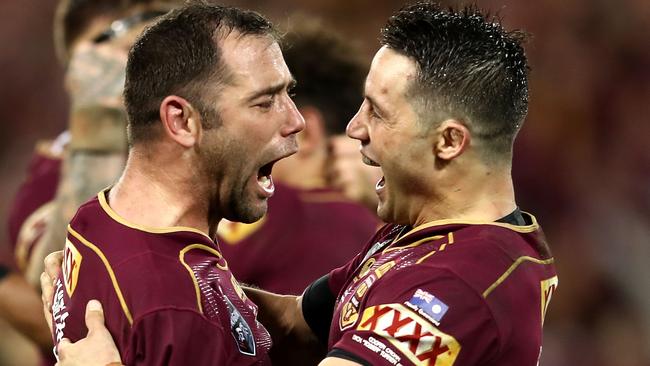 Cameron Smith and Cooper Cronk celebrate the Maroons win at Suncorp Stadium.