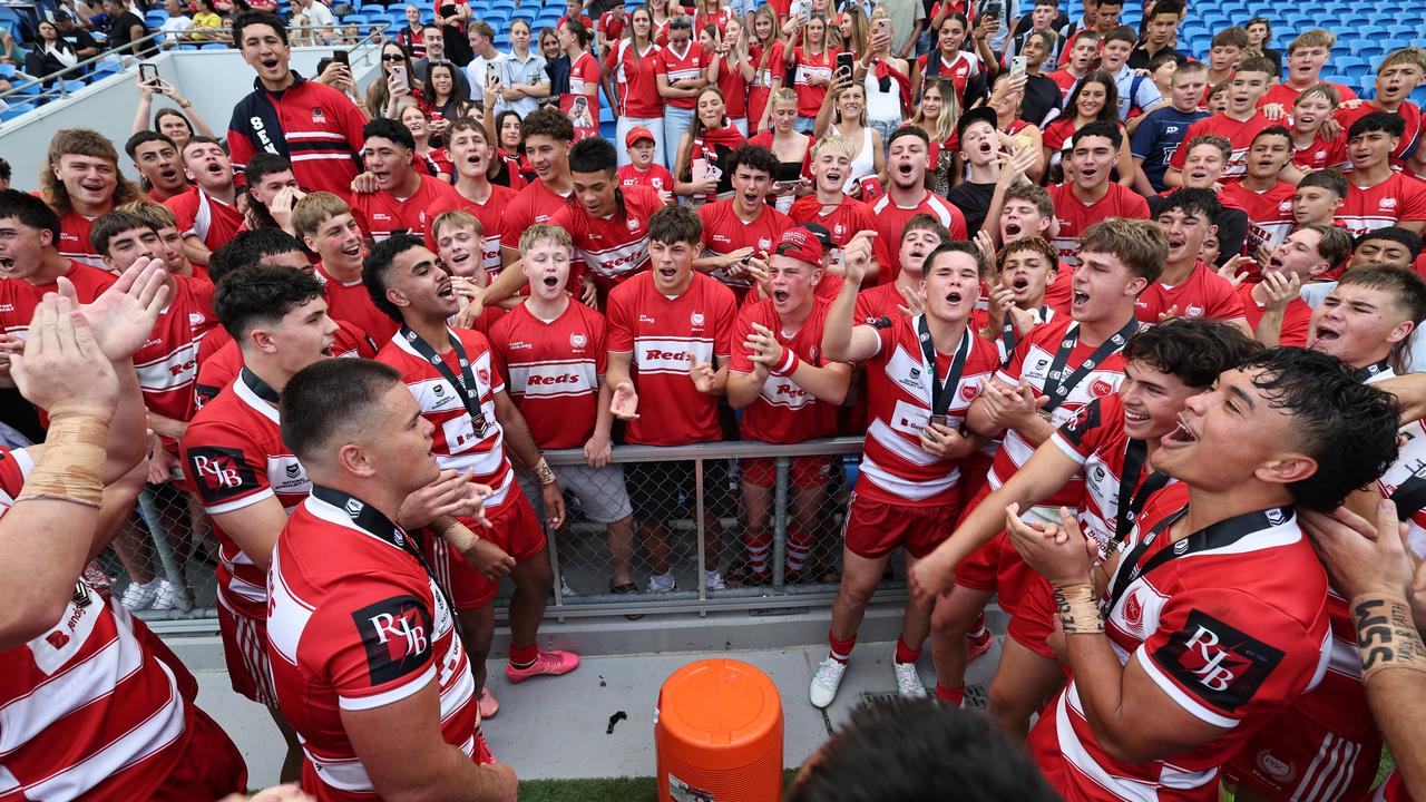 NRL National Schoolboys Cup final at CBUS Stadium between Palm Beach Currumbin and Patrician Blacktown Brothers. The Red Army and Palm Beach Currumbin players celebrate the win. .Picture Glenn Hampson