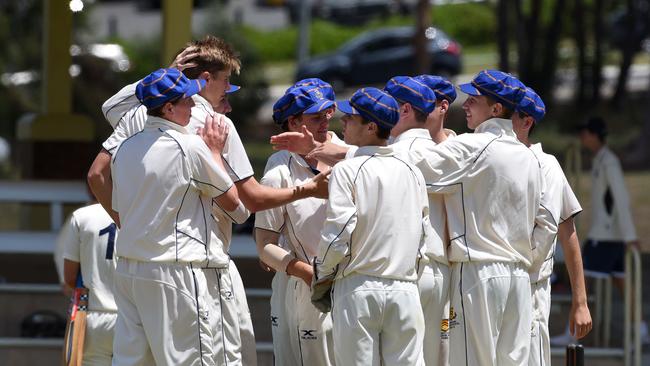 TGS players swamp Harry Weir after he takes a wicket. Picture: Steve Holland