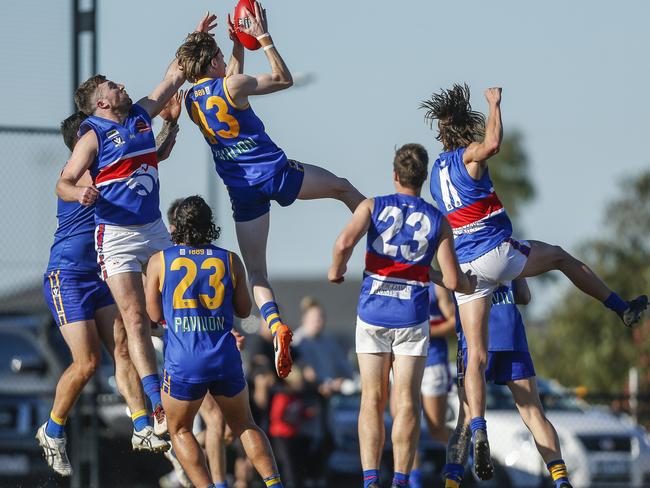 Cranbourne’s Mitch Tharle takes a big grab at Livingston Reserve in 2021. Picture: Valeriu Campan