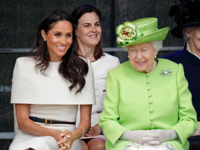 Meghan, Duchess of Sussex and Queen Elizabeth II (at rear, Samantha Cohen) at a ceremony to open the Mersey Gateway Bridge in 2018. Picture: Max Mumby/Indigo/Getty Images