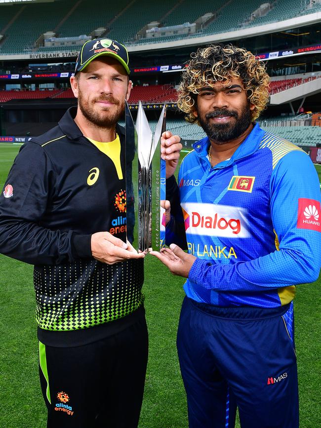 Finch and Malinga with the trophy. Picture: Mark Brake/Getty