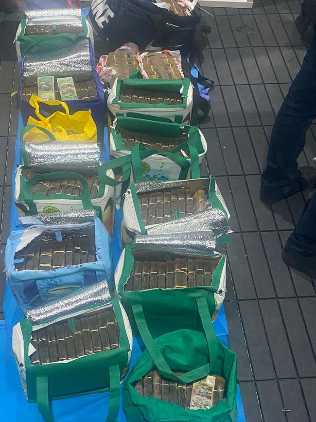 Bags of money seized by police last month.