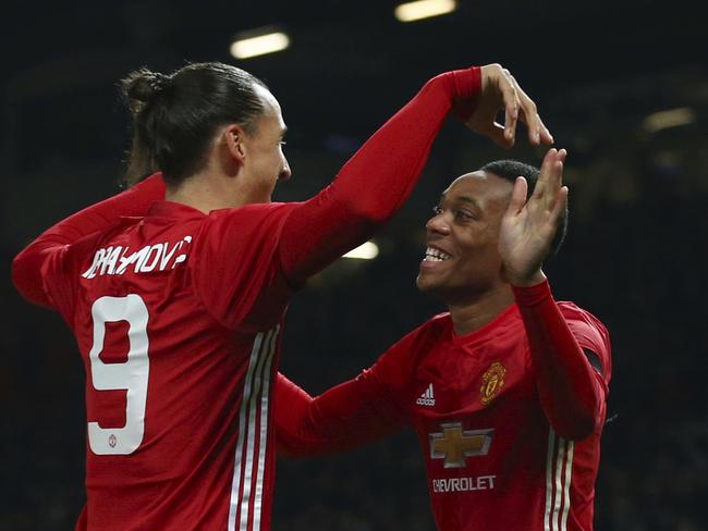 Manchester United's Anthony Martial, right, celebrates with teammate Manchester United's Zlatan Ibrahimovic after scoring his sides 2nd goal of the game during the English League Cup quarterfinal soccer match between manchester United and West Ham United at Old Trafford in Manchester, England Wednesday, Nov. 30, 2016. (AP Photo/Dave Thompson)