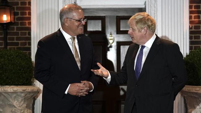 Scott Morrison greets Boris Johnson before a working dinner in Washington. Picture: Adam Taylor