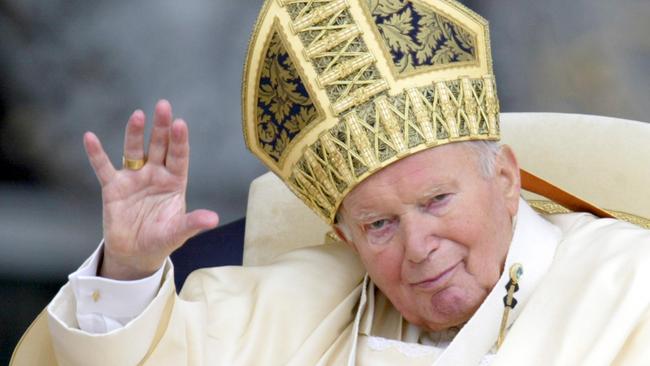 Pope John Paul II saluting the crowd in St Peter square at the Vatican in 2003. Picture: AFP