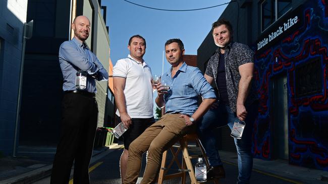 Luke Page, with brothers and Daniel, Michael and Anthony Vallelonga at Red Hen Gin Distillery in the city. Picture: Tom Huntley