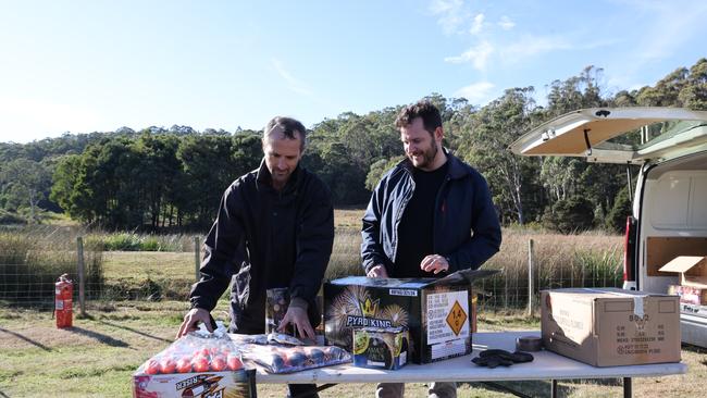 Brightstar Fireworks owner Matthew Palmer and Police, Fire and Emergency Management Minister Felix Ellis with fireworks prepped for Cracker Night. Picture: supplied