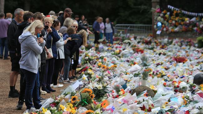 Well-wishers view floral tributes left at the Norwich Gate outside the Sandringham Estate in Sandringham, Norfolk, eastern England, on Sunday. Picture: AFP