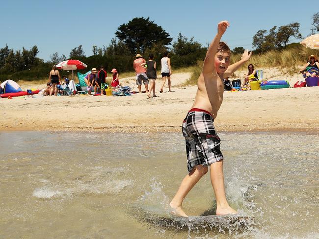 Anthony Humphrey 12 of Doncaster enjoys Rye beach on the last day of 2012. Picture: Hamish Blair