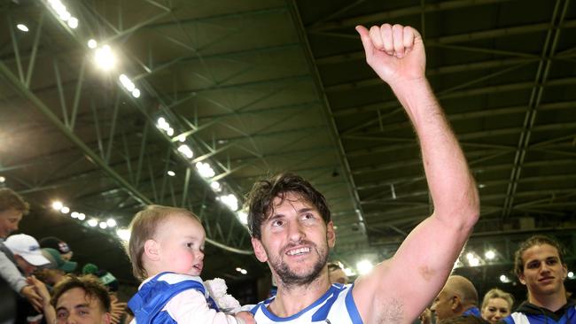 Jarrad Waite of the Kangaroos who is retiring leaves the field for the last time with child Lola after the Round 23 AFL match between the St Kilda Saints and the North Melbourne Kangaroos at Etihad Stadium in Melbourne, Sunday, August 26, 2018. (AAP Image/Hamish Blair) NO ARCHIVING, EDITORIAL USE ONLY