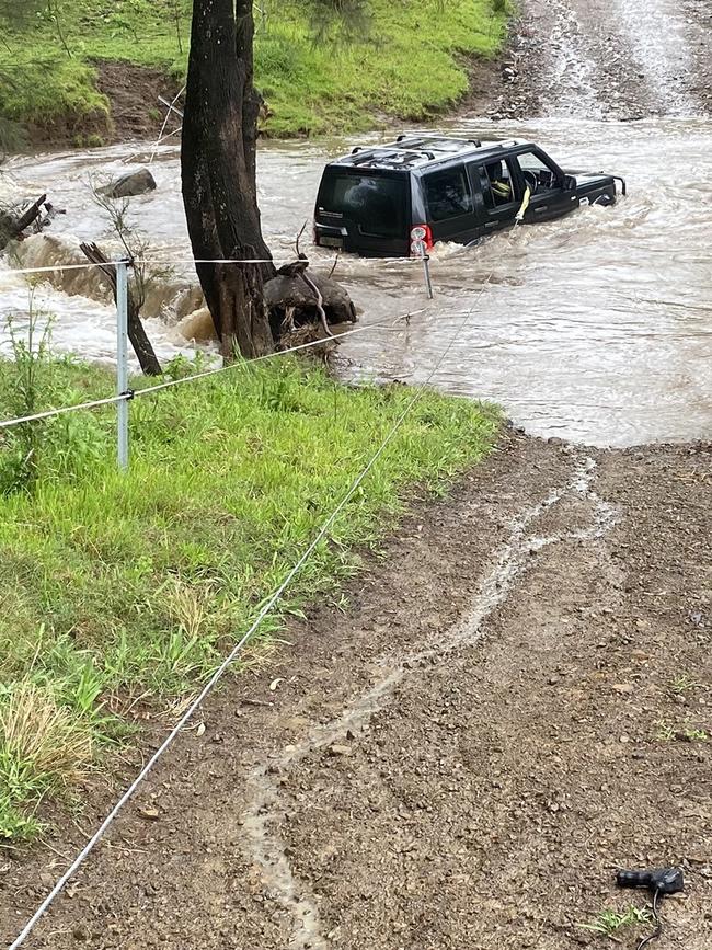 The stranded vehicle was left in a precarious position. Picture: NSW Police.