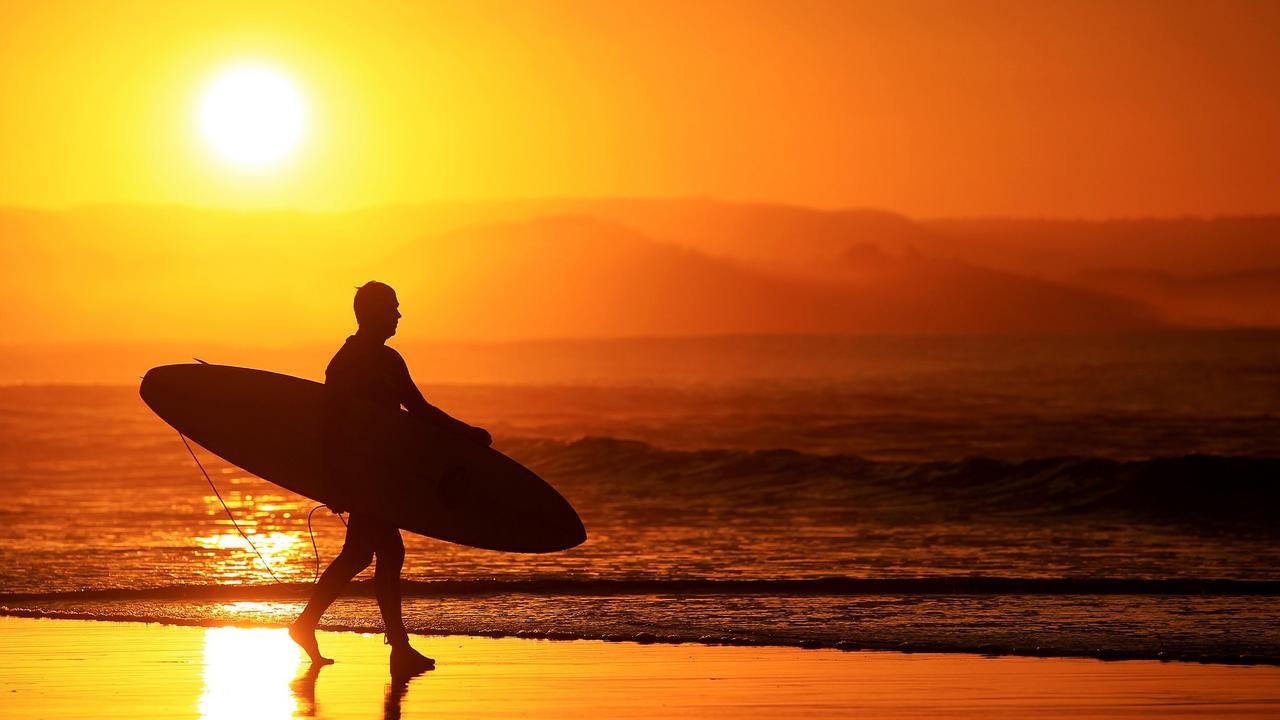 A surfer chases The Endless Summer - Coolangatta Queensland Photo Scott Powick