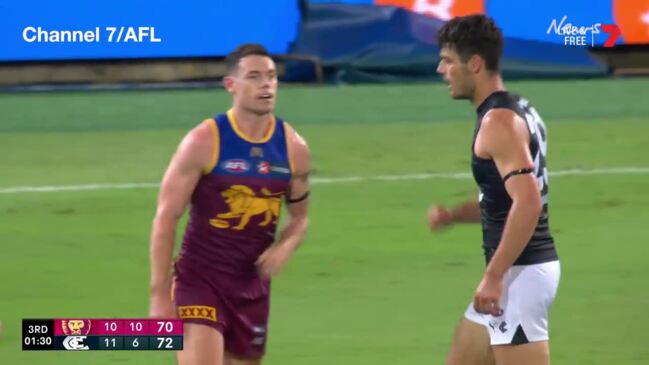 Lachie Neale and George Hewett exchange blows at the Gabba