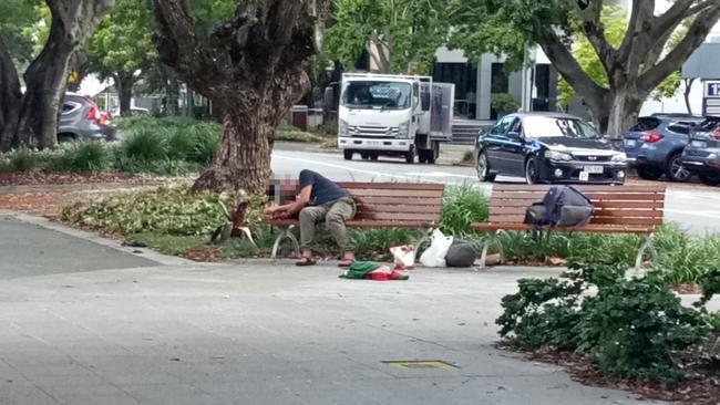 A person sleeping on a bench on Short St in Southport.