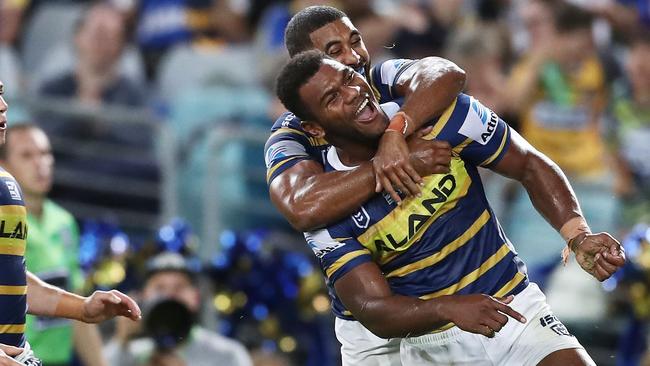 SYDNEY, AUSTRALIA - MARCH 29: Maika Sivo of the Eels celebrates with teammates after scoring a try during the round three NRL match between the Parramatta Eels and the Sydney Roosters at ANZ Stadium on March 29, 2019 in Sydney, Australia. (Photo by Matt King/Getty Images)