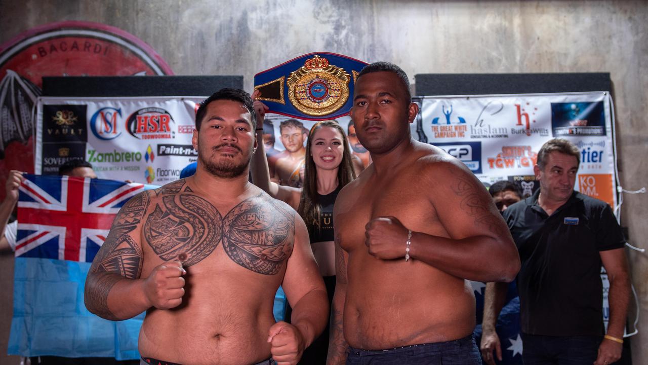 Toowoomba heavyweight Herman Ene-Purcell (left) and Fijian James Singh at today's weigh-in ahead of their WBF World Youth title bout tomorrow night at Rumours International. Picture: Tanner Smith