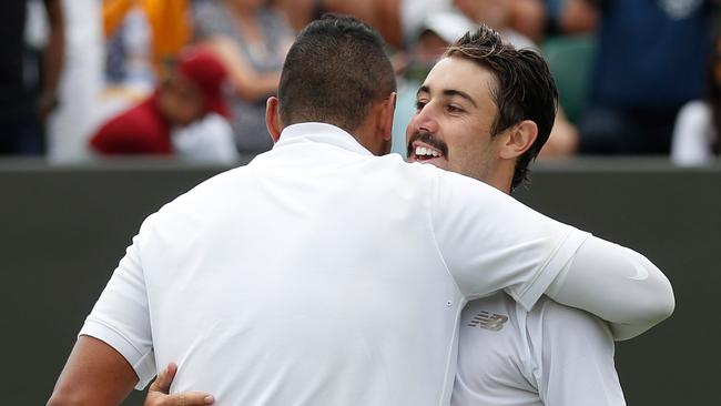 Nick Kyrgios and Jordan Thompson embrace after their five-set Wimbledon marathon. Picture: AFP