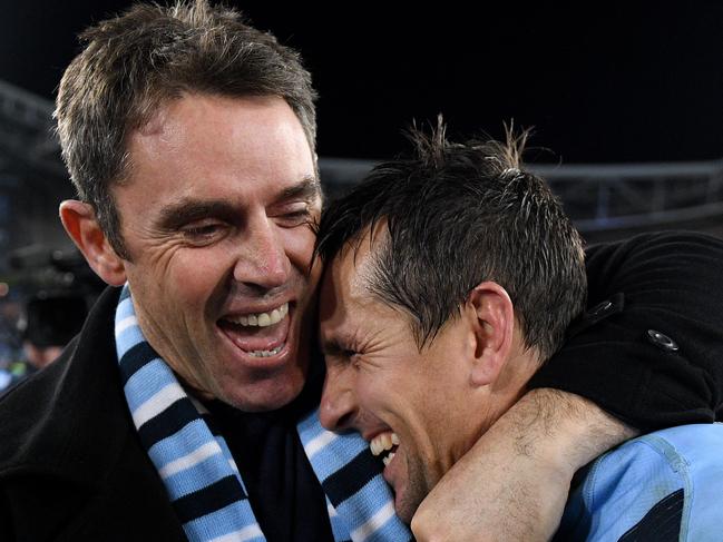 *This picture has been selected as one of the Best of the Year Sports images for 2019*  NSW Blues coach Brad Fittler celebrates with Mitchell Pearce following their win in Game 3 of the 2019 State of Origin series between the New South Wales Blues and the Queensland Maroons at ANZ Stadium in Sydney, Wednesday, July 10, 2019. (AAP Image/Dan Himbrechts) NO ARCHIVING, EDITORIAL USE ONLY