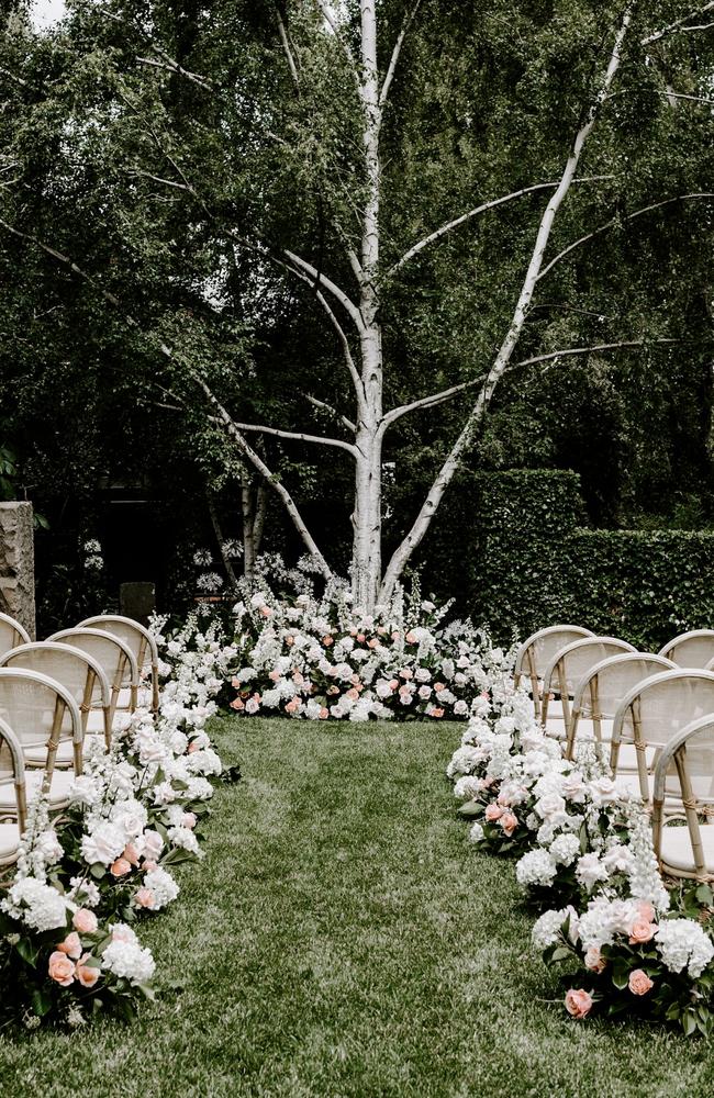 The loved-up couple tied the knot in a garden ceremony after a 10-year romance. Picture: Bianca Virtue