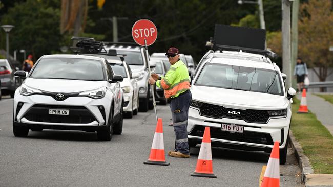 25/9/2023: Traffic control during a Broncos fan training session at the Red Hill, Brisbane. pic: Lyndon Mechielsen/Courier Mail