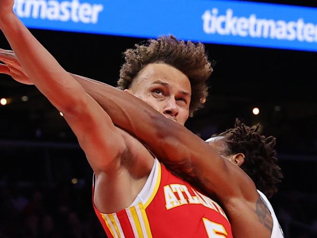 ATLANTA, GEORGIA - OCTOBER 23: Nic Claxton #33 of the Brooklyn Nets fouls Dyson Daniels #5 of the Atlanta Hawks during the fourth quarter at State Farm Arena on October 23, 2024 in Atlanta, Georgia. NOTE TO USER: User expressly acknowledges and agrees that, by downloading and or using this photograph, User is consenting to the terms and conditions of the Getty Images License Agreement. (Photo by Kevin C. Cox/Getty Images)