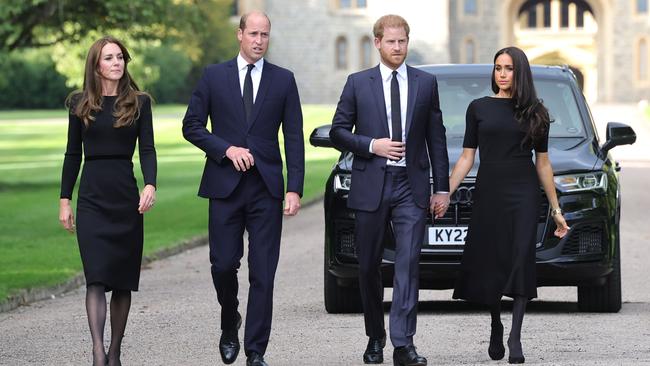 Catherine, Princess of Wales, Prince William, Prince of Wales, Prince Harry, Duke of Sussex, and Meghan, Duchess of Sussex join on the long Walk at Windsor Castle to view tributes left at the gates.