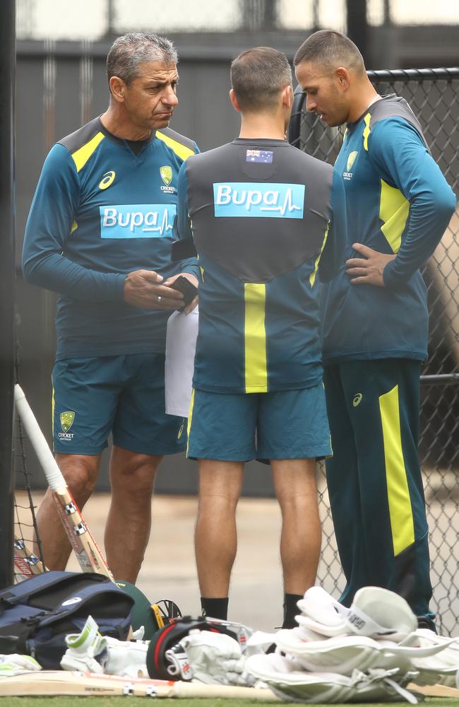 Distressed at the news of his brother’s arrest, Usman Khawaja speaks with Australian Team Security Manager Frank Dimasi and Australian Team Media Manager Jeremy Arnold in Adelaide on Tuesday. Picture: Getty