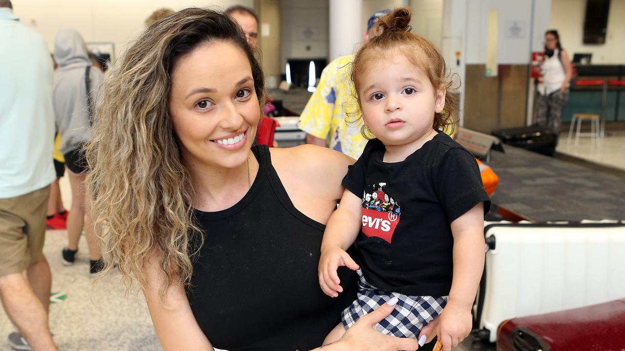 Suzy Reis with her son Zaidan after landing in Brisbane. Picture: Richard Gosling