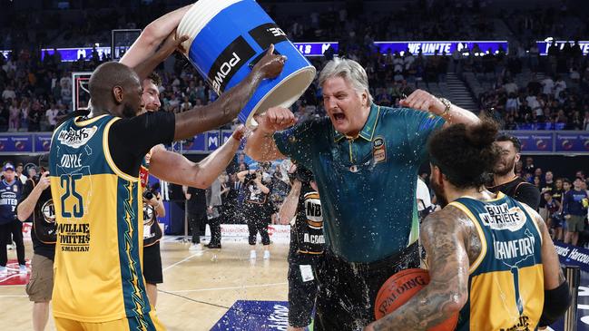 JackJumpers players celebrate with coach Scott Roth during game five of the NBL Championship Grand Final Series. Picture: Daniel Pockett/Getty Images