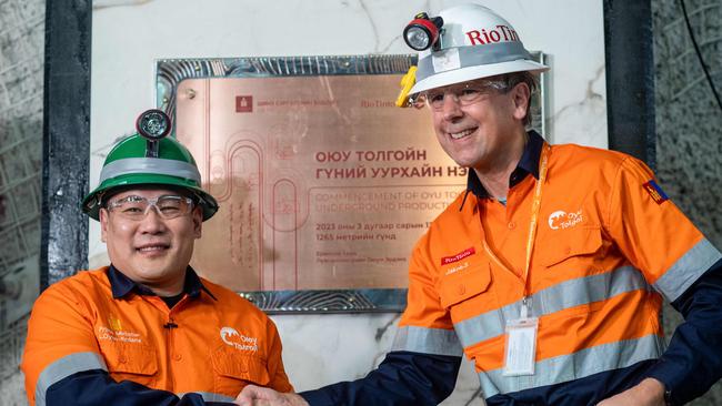 Mongolia's Prime Minister Luvsannamsrai Oyun-Erdene (L) shakes hands with CEO of Rio Tinto Group Jakob Stausholm at the Oyu Tolgoi copper mine in southern Mongolia. Picture: AFP.