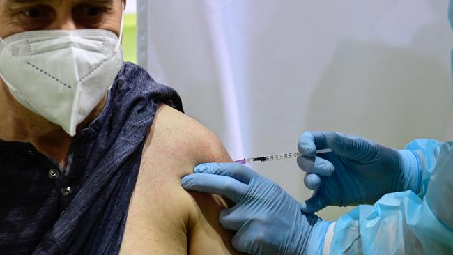 A patient receives the AstraZeneca COVID-19 vaccination at a new vaccination centre at the former Tempelhof airport in Berlin, Germany. Picture: AFP