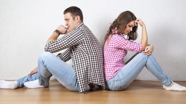 Couple sitting with their backs turned after having an argument