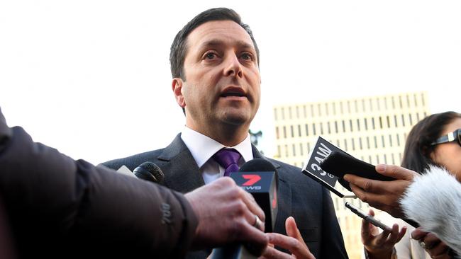 Mr Guy speaks to media outside Parliament House this morning. Picture: AAP